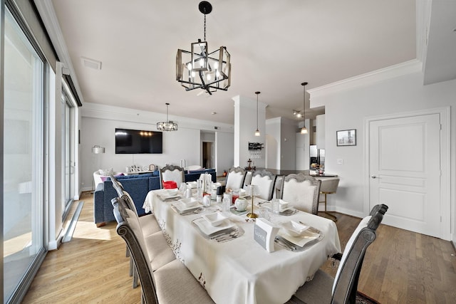3333 Allen Pkwy Unit 908, Houston, TX 77019 - dining space featuring a chandelier, light wood-style flooring, ornamental molding, and baseboards