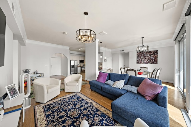 3333 Allen Pkwy Unit 908, Houston, TX 77019 - living area with a chandelier, light wood-type flooring, ornamental molding, and baseboards