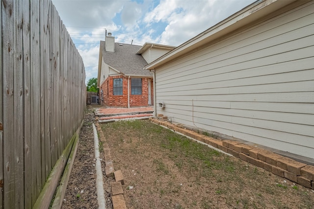 8621 Rustling Lvs Dr, Houston, TX 77083 - view of yard featuring central AC