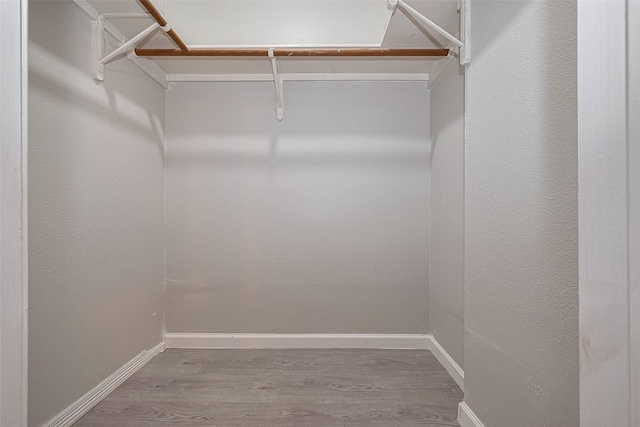 8621 Rustling Lvs Dr, Houston, TX 77083 - spacious closet featuring wood finished floors