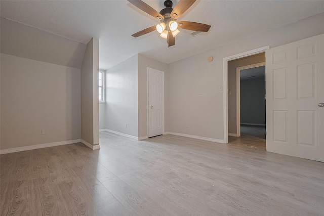 8621 Rustling Lvs Dr, Houston, TX 77083 - spare room featuring a ceiling fan, light wood-style floors, and baseboards