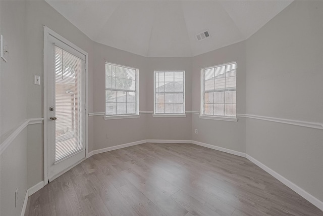 8621 Rustling Lvs Dr, Houston, TX 77083 - unfurnished room featuring wood finished floors, baseboards, and lofted ceiling