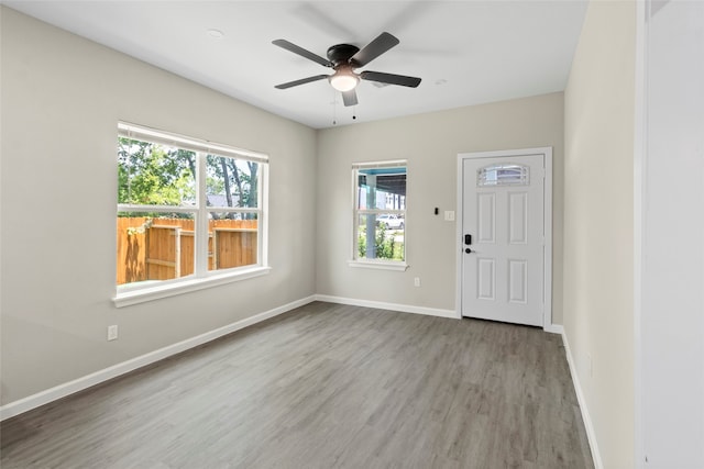 8402 Bassett St, Houston, TX 77051 - entrance foyer featuring wood finished floors, a ceiling fan, and baseboards