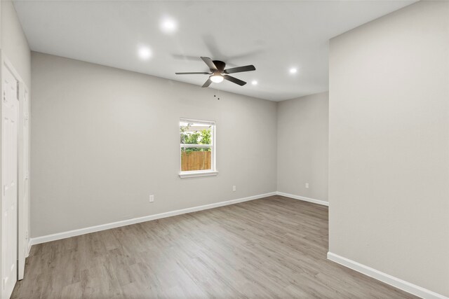 8402 Bassett St, Houston, TX 77051 - spare room with a ceiling fan, recessed lighting, wood finished floors, and baseboards