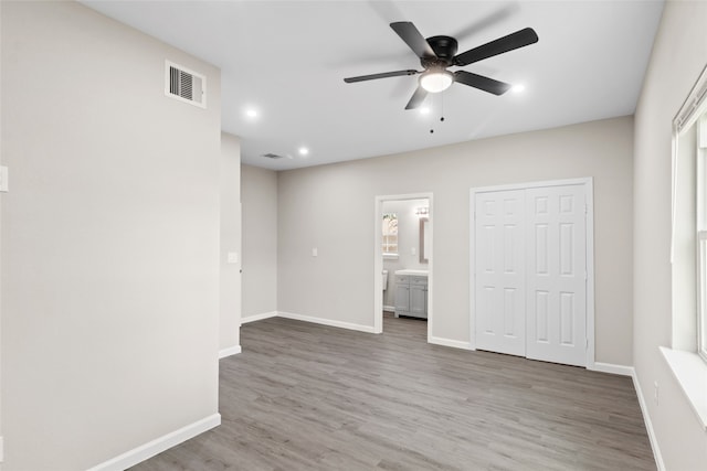 8402 Bassett St, Houston, TX 77051 - spare room featuring wood finished floors, a ceiling fan, baseboards, and recessed lighting