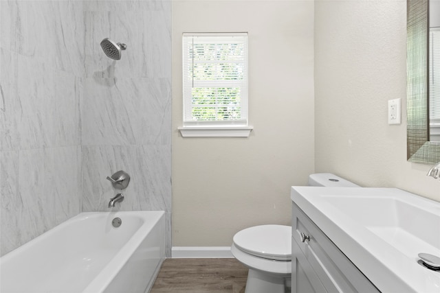 8402 Bassett St, Houston, TX 77051 - full bath featuring toilet, vanity, bathtub / shower combination, wood finished floors, and baseboards