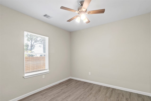8402 Bassett St, Houston, TX 77051 - unfurnished room with light wood-style floors, baseboards, and ceiling fan