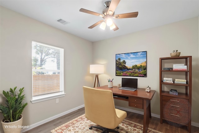 8402 Bassett St, Houston, TX 77051 - office with wood finished floors, baseboards, and a ceiling fan