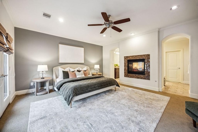1604 Fowler St, Houston, TX 77007 - bedroom with arched walkways, crown molding, carpet flooring, recessed lighting, and baseboards