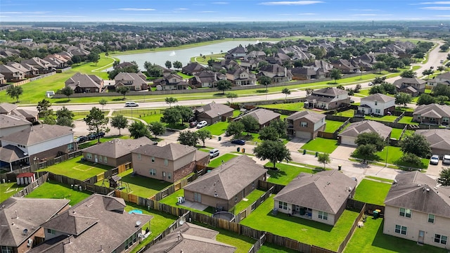 9822 Garnet Springs Dr, Iowa Colony, TX 77583 - aerial perspective of suburban area featuring a nearby body of water