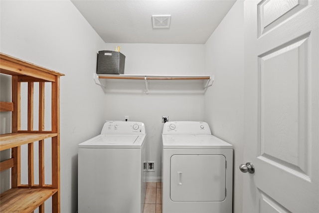 9822 Garnet Springs Dr, Iowa Colony, TX 77583 - laundry area featuring independent washer and dryer, baseboards, and light tile patterned floors