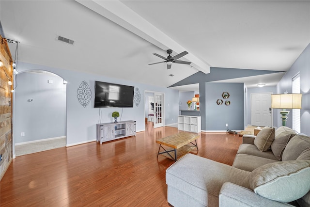 9822 Garnet Springs Dr, Iowa Colony, TX 77583 - living area featuring a ceiling fan, arched walkways, wood finished floors, and baseboards