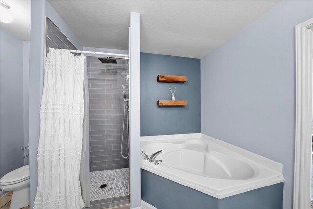 9822 Garnet Springs Dr, Iowa Colony, TX 77583 - full bathroom with a bath, a shower stall, and toilet