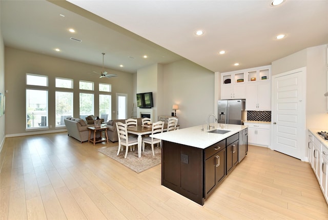 22911 Pearl Glen Dr, Richmond, TX 77469 - kitchen with stainless steel appliances, a sink, ceiling fan, light countertops, and recessed lighting
