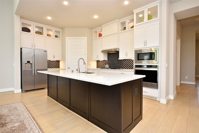 22911 Pearl Glen Dr, Richmond, TX 77469 - kitchen with appliances with stainless steel finishes, a sink, light wood finished floors, baseboards, and recessed lighting