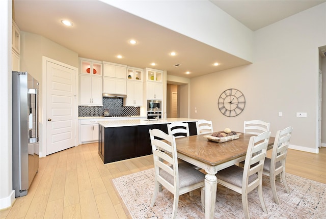 22911 Pearl Glen Dr, Richmond, TX 77469 - dining space featuring light wood-type flooring and recessed lighting