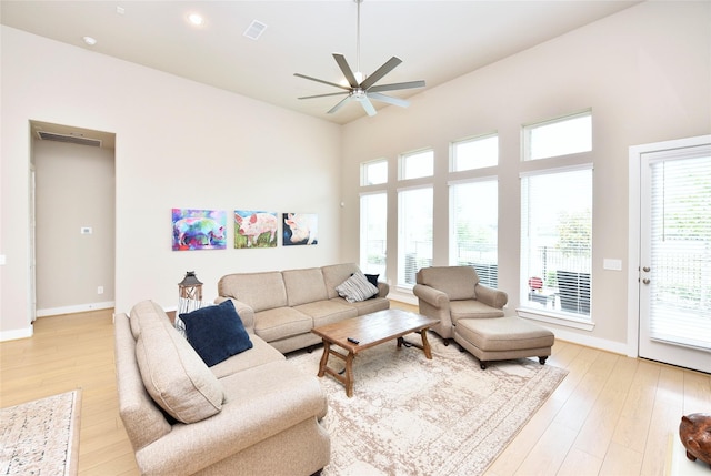 22911 Pearl Glen Dr, Richmond, TX 77469 - living area with a ceiling fan, light wood-style floors, and baseboards