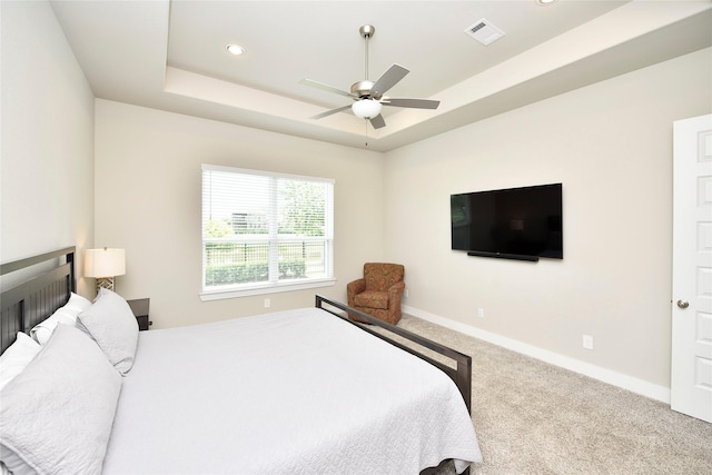 22911 Pearl Glen Dr, Richmond, TX 77469 - carpeted bedroom featuring baseboards, recessed lighting, a tray ceiling, and a ceiling fan