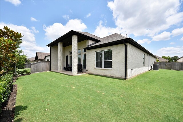 22911 Pearl Glen Dr, Richmond, TX 77469 - back of house featuring brick siding, cooling unit, a patio, and roof with shingles