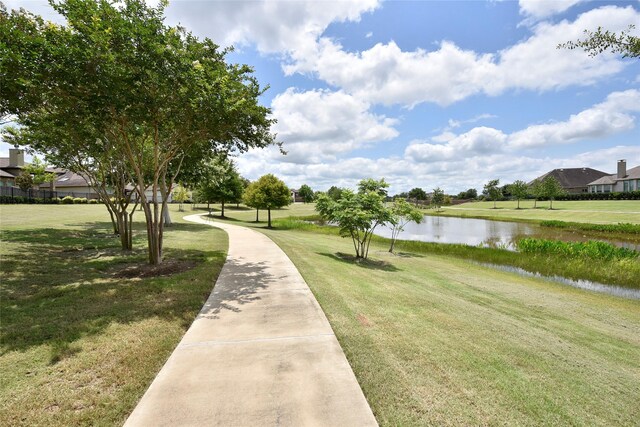 22911 Pearl Glen Dr, Richmond, TX 77469 - surrounding community with a water view and a lawn