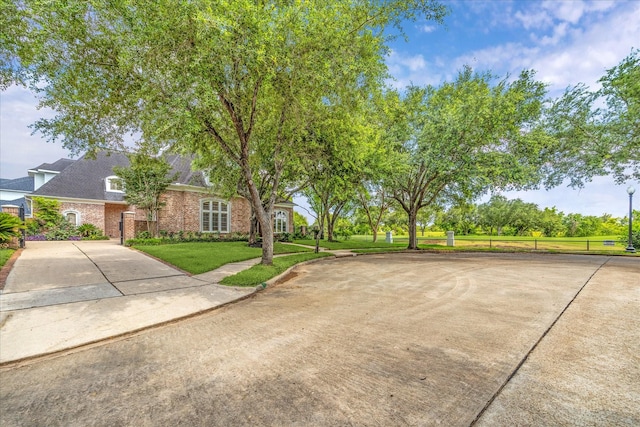 4111 Thistle Hill Ct, Sugar Land, TX 77479 - exterior space with concrete driveway