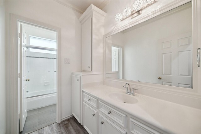 4111 Thistle Hill Ct, Sugar Land, TX 77479 - full bathroom with vanity, bathing tub / shower combination, ornamental molding, and wood finished floors