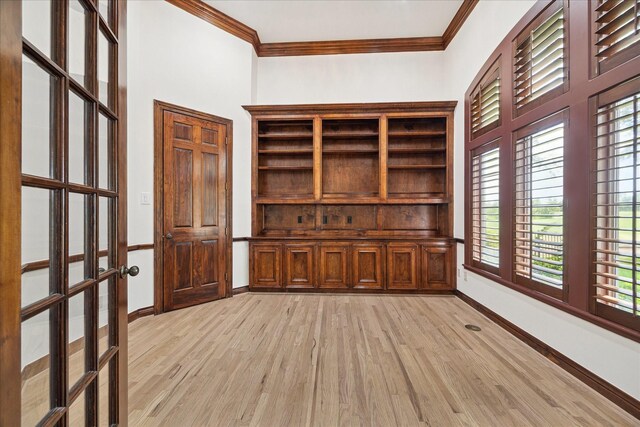 4111 Thistle Hill Ct, Sugar Land, TX 77479 - spare room featuring crown molding, light wood finished floors, baseboards, and french doors