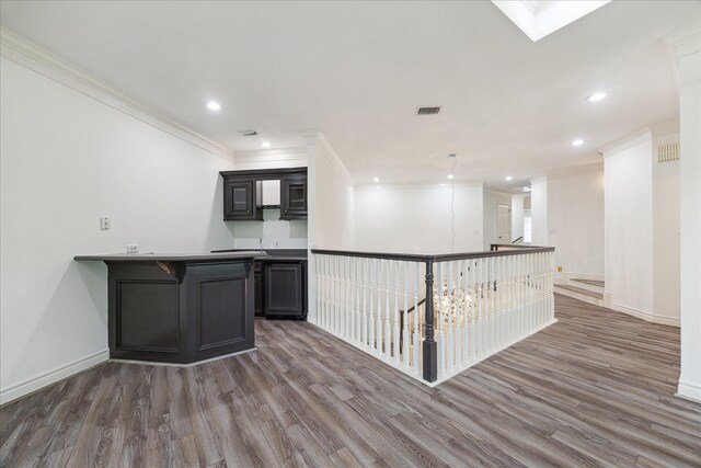 4111 Thistle Hill Ct, Sugar Land, TX 77479 - bar with wood finished floors, ornamental molding, recessed lighting, and baseboards
