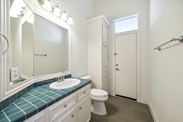 4111 Thistle Hill Ct, Sugar Land, TX 77479 - bathroom with vanity, toilet, wood finished floors, and crown molding