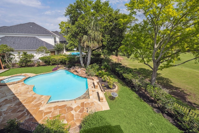 4111 Thistle Hill Ct, Sugar Land, TX 77479 - view of swimming pool with a yard, a patio area, and a pool with connected hot tub