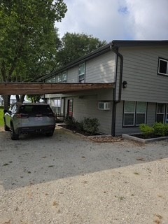 480 Johnson Rd, Coldspring, TX 77331 - view of side of property featuring a detached carport and driveway