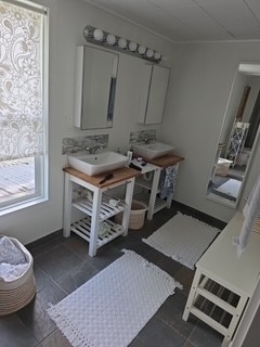 480 Johnson Rd, Coldspring, TX 77331 - bathroom with a sink and crown molding