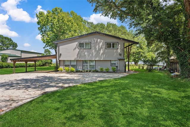 480 Johnson Rd, Coldspring, TX 77331 - back of house with a lawn and gravel driveway