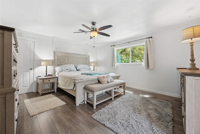 480 Johnson Rd, Coldspring, TX 77331 - bedroom with baseboards, wood finished floors, and a ceiling fan