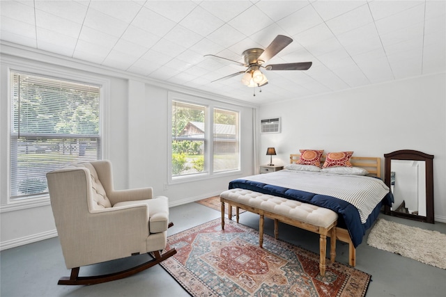 480 Johnson Rd, Coldspring, TX 77331 - bedroom featuring multiple windows, concrete floors, and baseboards