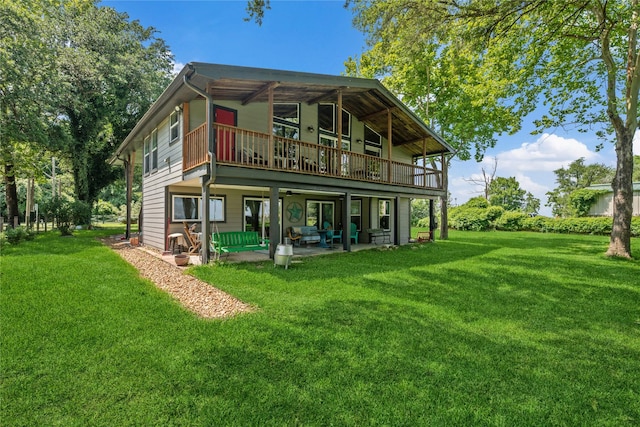 480 Johnson Rd, Coldspring, TX 77331 - back of house featuring a patio and a lawn