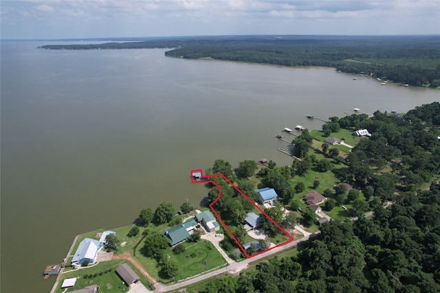 480 Johnson Rd, Coldspring, TX 77331 - aerial overview of property's location featuring a nearby body of water, property parcel outlined, and a heavily wooded area