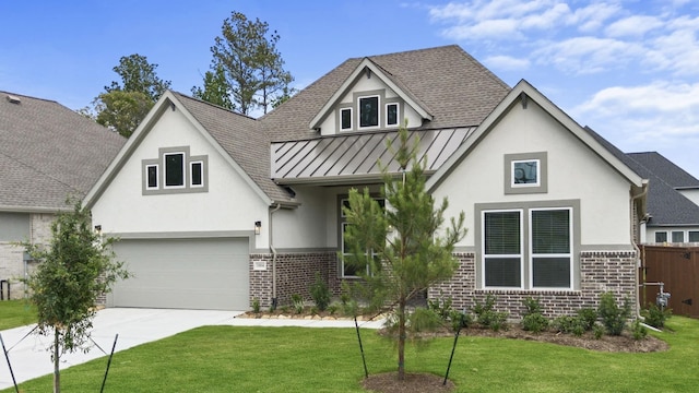 12834 Forest Garden Ct, Conroe, TX 77302 - view of front facade featuring brick siding, stucco siding, a standing seam roof, and driveway