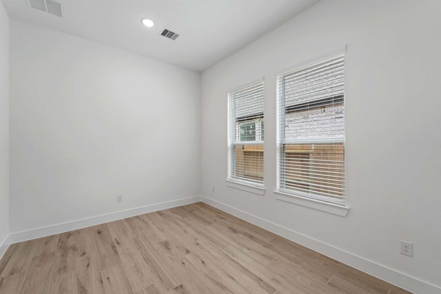 12834 Forest Garden Ct, Conroe, TX 77302 - empty room with baseboards, light wood-style flooring, and recessed lighting