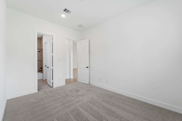 12834 Forest Garden Ct, Conroe, TX 77302 - unfurnished bedroom with light colored carpet, baseboards, and recessed lighting