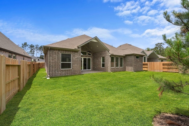12834 Forest Garden Ct, Conroe, TX 77302 - rear view of house with brick siding and a shingled roof