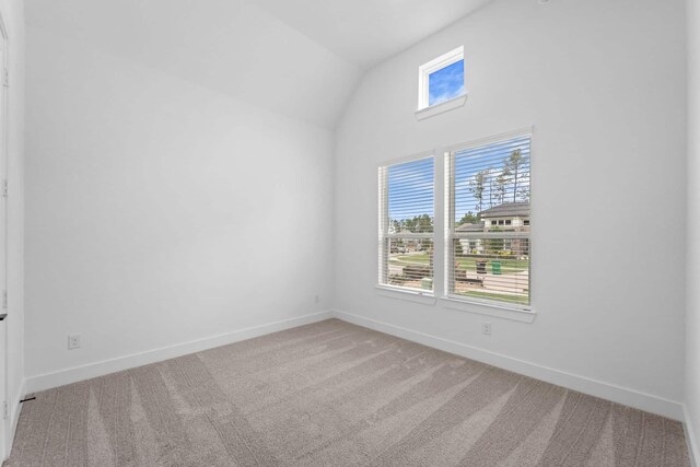 12834 Forest Garden Ct, Conroe, TX 77302 - unfurnished room with vaulted ceiling, carpet flooring, and baseboards