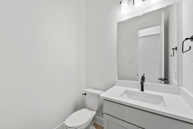 12834 Forest Garden Ct, Conroe, TX 77302 - half bathroom featuring vanity, toilet, and baseboards