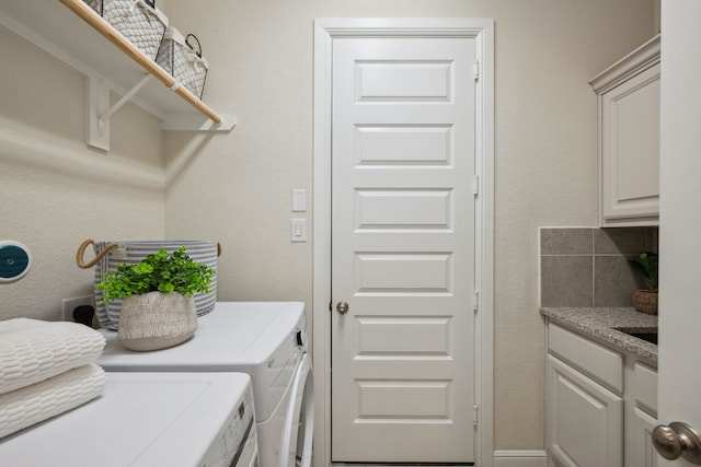 4051 Ashland Woods Dr, Spring, TX 77386 - washroom featuring washer and dryer and cabinet space