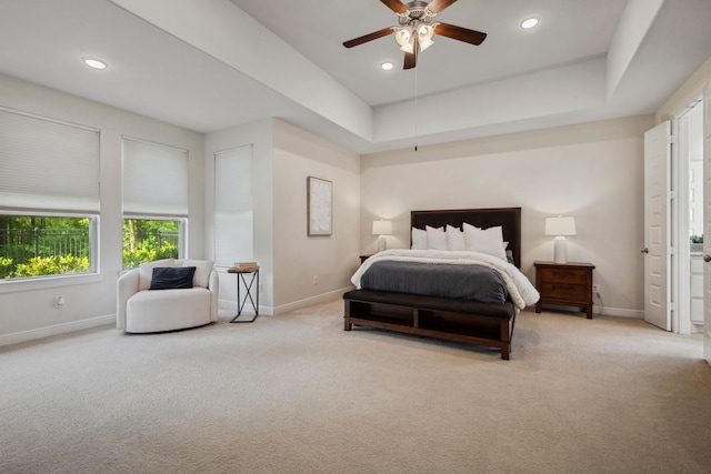 4051 Ashland Woods Dr, Spring, TX 77386 - carpeted bedroom with baseboards, recessed lighting, ceiling fan, and a tray ceiling