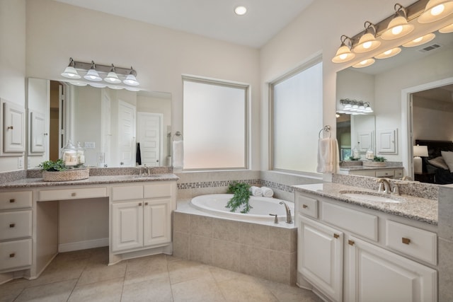 4051 Ashland Woods Dr, Spring, TX 77386 - full bathroom featuring a bath, two vanities, and tile patterned flooring