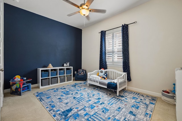 4051 Ashland Woods Dr, Spring, TX 77386 - carpeted bedroom featuring a crib and a ceiling fan