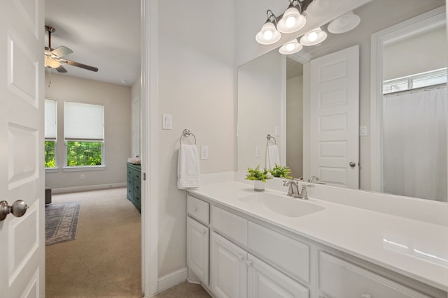 4051 Ashland Woods Dr, Spring, TX 77386 - bathroom with vanity, ceiling fan, and baseboards