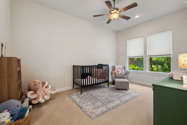 4051 Ashland Woods Dr, Spring, TX 77386 - bedroom featuring carpet floors, a nursery area, baseboards, and ceiling fan