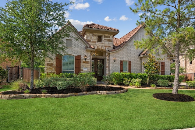 4051 Ashland Woods Dr, Spring, TX 77386 - view of front of house featuring a tile roof and stone siding